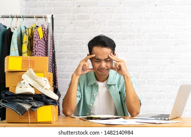 Asian man being frustrated working laptop computer, Selling online start up small business owner, e-commerce ideas concept