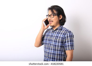 The asian man in the blue plaid shirt is calling the phone. - Powered by Shutterstock