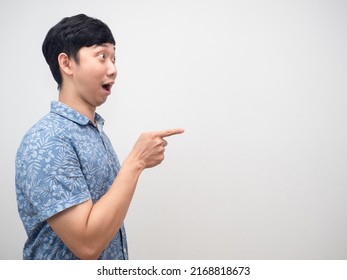 Asian Man Blue Shirt Side View Excited Point Finger At Copy Space