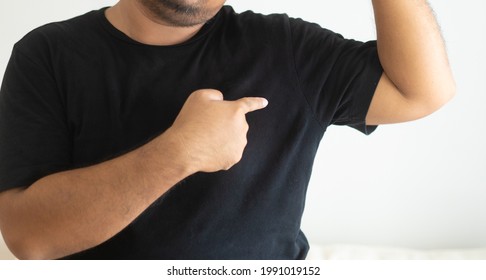 Asian Man Body With Sweat On Black T Shirt Workout Fit From Home.bad Smell Breathing On Armpit With Black Shirt.indian Man Smelly.hyperhidrosis, Deodorant, Medical Health.Men Skin Body Care.