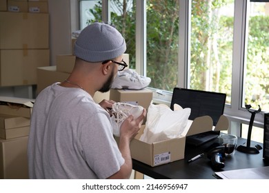 Asian Man Business Owner Working, Packing The Order For Shipping To Customer. Male Entrepreneur Packaging Box For Delivery In Store Warehouse.