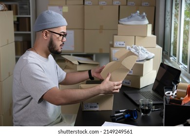 Asian Man Business Owner Working, Packing The Order For Shipping To Customer. Male Entrepreneur Packaging Box For Delivery In Store Warehouse.