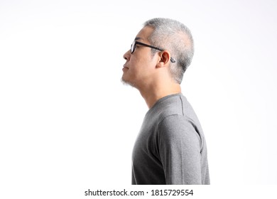 The Asian Man With Buzz Hair Standing On The White Background.