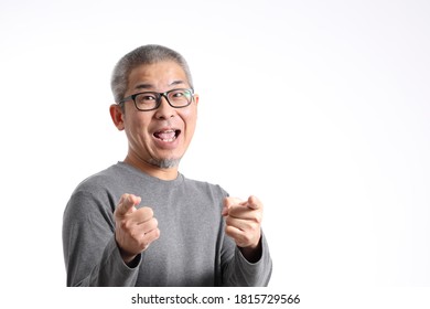 The Asian Man With Buzz Hair Standing On The White Background.