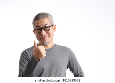 The Asian Man With Buzz Hair Standing On The White Background.