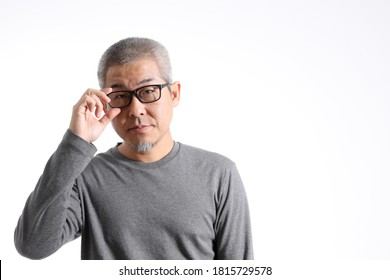 The Asian Man With Buzz Hair Standing On The White Background.