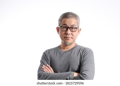 The Asian Man With Buzz Hair Standing On The White Background.