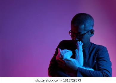 The Asian Man With Buzz Haircut Is Shot With Studio Gel Lighting.