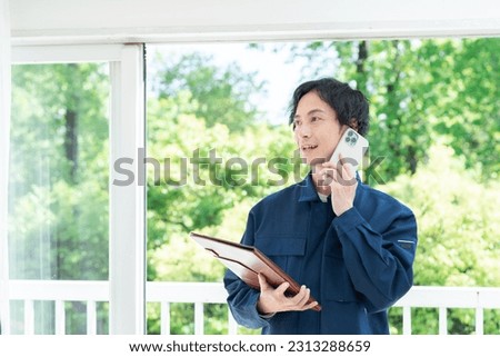 Asian man calling with smartphone