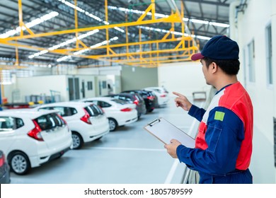 Asian Man Car Inspector Staff Checking Stock In The Car Service Center