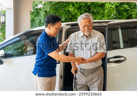Asian man caregiver or taxi driver helping senior man patient get in the car to get to medical appointments or healthcare therapy sessions at hospital. Assisted elderly patient transportation services