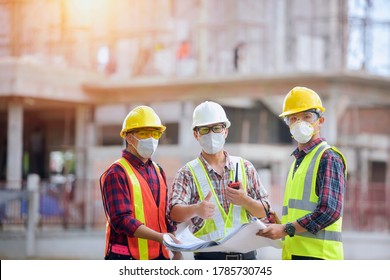 Asian Man Civil Engineer Architect Wearing Safety Helmet Meeting At Contruction Site.Architecture Engineering Teamwork Meeting At Workplace