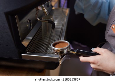 Asian Man Coffee Shop Part Time Employee Brew Hot Coffee In Coffee Machine. Male Barista Hand Making Espresso From Ground Coffee Maker At Modern Cafe. Small Business And Part Time Job Working Concept.