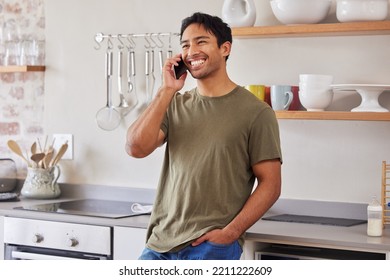 Asian man, communication and phone call in kitchen while laughing, happy and talking to contact with 5g network at home. Male with a smile while networking and having conversation about good service - Powered by Shutterstock