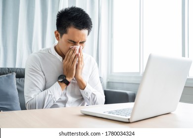 Asian man coughing laptop video call online appointment with doctor checkup examining diagnosing patient medical healthcare, at home modern office quarantine coronavirus covid-19 illness sickness  - Shutterstock ID 1780034324