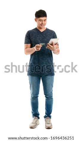 Similar – young latin man typing on his phone with emoji emoticons.