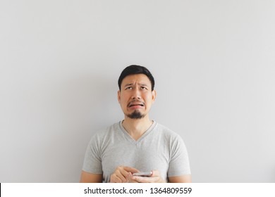 Asian Man Cry And Sad With What Show On The Smartphone.