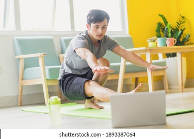 Asian Man Doing Exercise At Home
