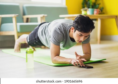 Asian Man Doing Exercise At Home
