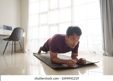 Asian Man Doing Workout Sport Plank At Home