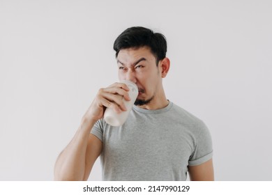 Asian Man Drink Bad Taste Of Protein Chicken Shake For Health Isolated On White.