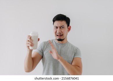 Asian Man Drink Bad Taste Of Protein Chicken Shake For Health Isolated On White.