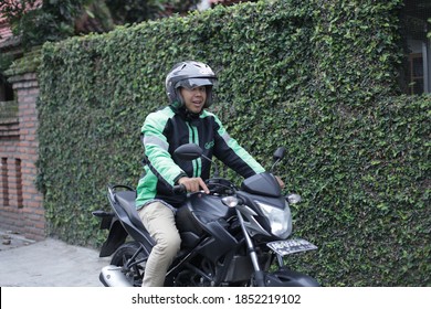 Asian Man Driver Grab With Helmet Using Motorcycle Rider. November 10, 2020. Jakarta Indonesia