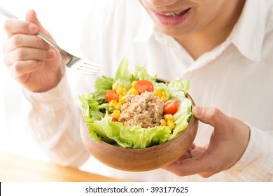 Asian Man Eating Salad