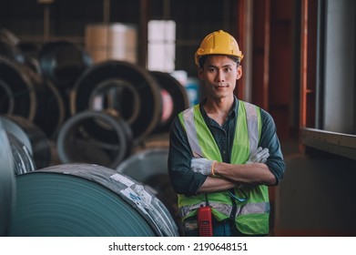 Asian man engineer  working hard in factory , worker employee  hard hat safety control machine factory 
