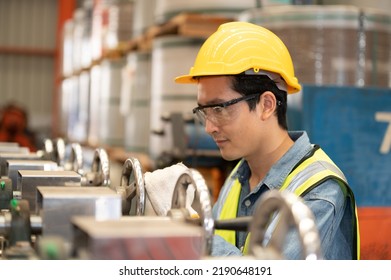 Asian man engineer  working hard in factory , worker employee  hard hat safety control machine factory  - Powered by Shutterstock