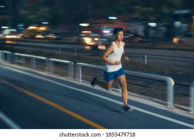 Asian Man Exercise Practicing Running At Night