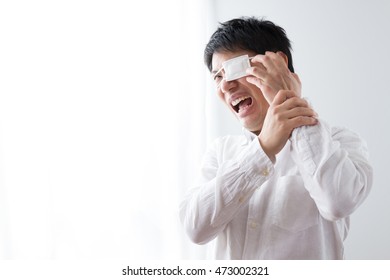 Asian Man With The Eyepatch