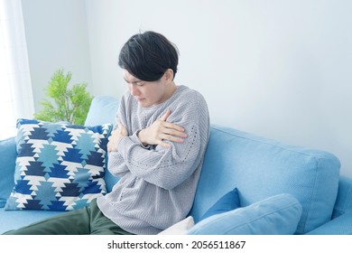 Asian Man Feeling Cold In The Room