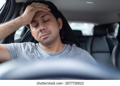 Asian Man Feeling Stressed In A Car From Traffic Jam