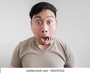 Asian Man Feels Shock And Surprise With Overly Face Expression.