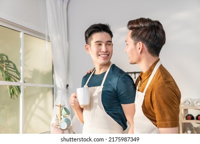 
Asian Man Gay Family In Apron Standing And Drink Coffee For Breakfast. Attractive Romantic Male Lgbtq Couple Celebrate Anniversary Or Spending Time On Vacation In Kitchen. Homosexual-LGBTQ Concept.
