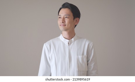 Asian Man In A Gentle Uniform