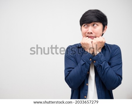 Asian man gesture afraid and looking at copy space white isolated
