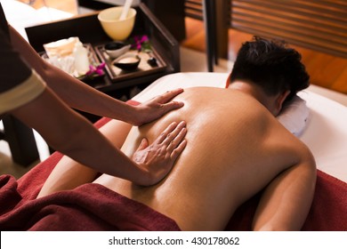 Asian Man Getting Massage In Spa