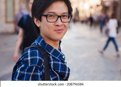 Asian Man With Glasses Stand At Street, Closeup Portrait