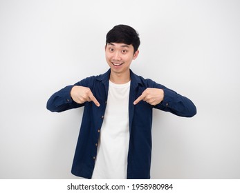 Asian man happy smile face point finger down looking at camera on white isolated background