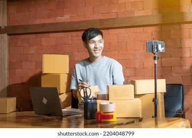 Asian Man Hold Package Box, Using Mobile Phone Call Receiving Purchase Order, Working At Home Office