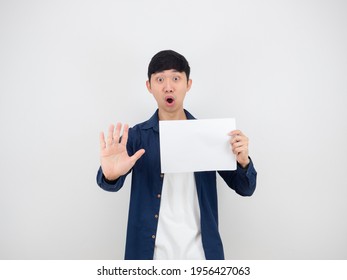 Asian Man Holding Blank Sheet And Show Hand Up Say No Serious Face On White Isolated Background,