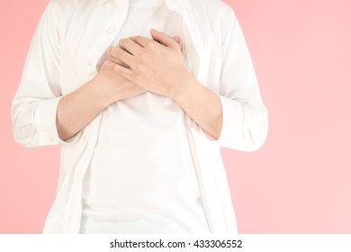 Asian Man Holding His Chest