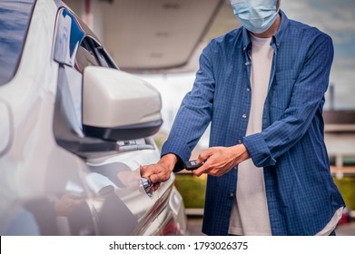 Asian Man Holding Key Open Car Door 