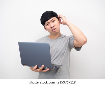 Asian Man Holding Laptop Gesture Bored Looking At Camera