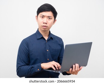 Asian Man Holding Laptop Serious Face Looking At Camera