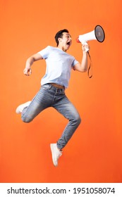 Asian Man Holding Megaphone And Shouting