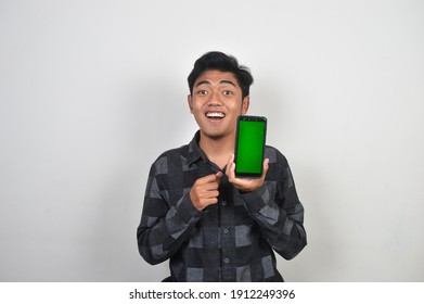 Asian Man Holding Mobile Phone With Green Screen