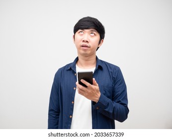 Asian Man Holding Mobile Phone And Feeling Bored Gesture Looking Up White Background